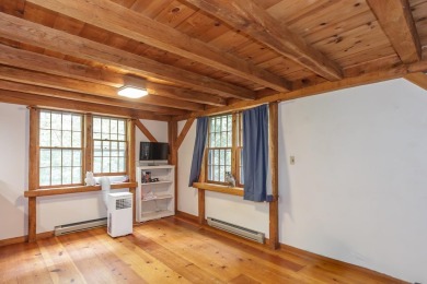 Tucked at the end of a quiet cul-de-sac, this post-and-beam cape on Eastman Golf Links in New Hampshire - for sale on GolfHomes.com, golf home, golf lot