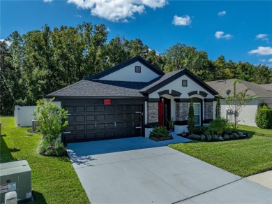 Step into modern comfort and style with this stunning 4-bedroom on Lexington Oaks Golf Club in Florida - for sale on GolfHomes.com, golf home, golf lot