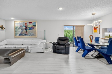 Welcome to your charming first-floor corner unit with beautiful on Hunters Run Golf and Country Club in Florida - for sale on GolfHomes.com, golf home, golf lot
