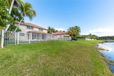 GORGEOUS LAKE FRONT HOME IN THE HIGHLY DESIRABLE GATED COMMUNITY on Weston Hills Country Club in Florida - for sale on GolfHomes.com, golf home, golf lot