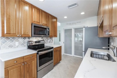 If you've been waiting for a main floor condo with a two-car on  in Florida - for sale on GolfHomes.com, golf home, golf lot