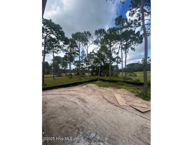 A gorgeous new home on the fairways of the prestigious Tiger's on Ocean Ridge Plantation in North Carolina - for sale on GolfHomes.com, golf home, golf lot