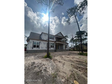 A gorgeous new home on the fairways of the prestigious Tiger's on Ocean Ridge Plantation in North Carolina - for sale on GolfHomes.com, golf home, golf lot