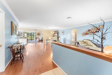 Enjoy easy Florida living in this well-cared-for 3-bedroom on Palm Beach National Golf and Country Club in Florida - for sale on GolfHomes.com, golf home, golf lot