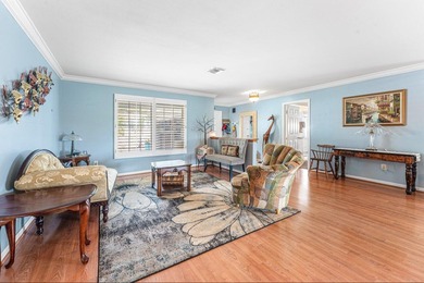 Enjoy easy Florida living in this well-cared-for 3-bedroom on Palm Beach National Golf and Country Club in Florida - for sale on GolfHomes.com, golf home, golf lot