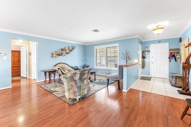 Enjoy easy Florida living in this well-cared-for 3-bedroom on Palm Beach National Golf and Country Club in Florida - for sale on GolfHomes.com, golf home, golf lot