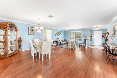 Enjoy easy Florida living in this well-cared-for 3-bedroom on Palm Beach National Golf and Country Club in Florida - for sale on GolfHomes.com, golf home, golf lot