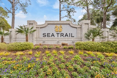 Luxury, views, and location -- this stunning end-unit elevator on Sea Trail Golf Resort in North Carolina - for sale on GolfHomes.com, golf home, golf lot