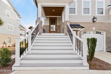 Luxury, views, and location -- this stunning end-unit elevator on Sea Trail Golf Resort in North Carolina - for sale on GolfHomes.com, golf home, golf lot