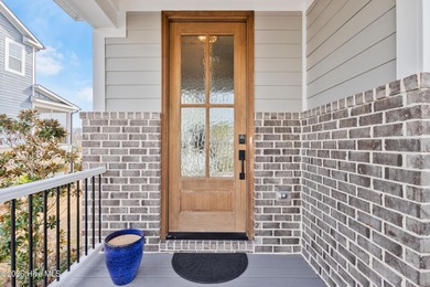 Luxury, views, and location -- this stunning end-unit elevator on Sea Trail Golf Resort in North Carolina - for sale on GolfHomes.com, golf home, golf lot
