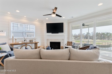 Luxury, views, and location -- this stunning end-unit elevator on Sea Trail Golf Resort in North Carolina - for sale on GolfHomes.com, golf home, golf lot