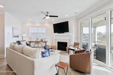 Luxury, views, and location -- this stunning end-unit elevator on Sea Trail Golf Resort in North Carolina - for sale on GolfHomes.com, golf home, golf lot