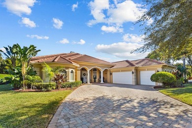 Experience luxury and privacy in this stunning home set on .67 on The Cape Club of Palm City in Florida - for sale on GolfHomes.com, golf home, golf lot