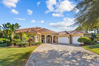 Experience luxury and privacy in this stunning home set on .67 on The Cape Club of Palm City in Florida - for sale on GolfHomes.com, golf home, golf lot