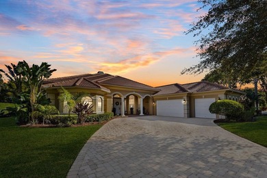 Experience luxury and privacy in this stunning home set on .67 on The Cape Club of Palm City in Florida - for sale on GolfHomes.com, golf home, golf lot