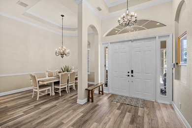 Experience luxury and privacy in this stunning home set on .67 on The Cape Club of Palm City in Florida - for sale on GolfHomes.com, golf home, golf lot