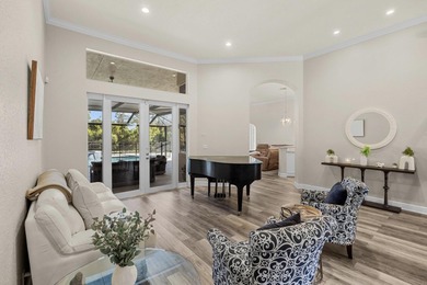 Experience luxury and privacy in this stunning home set on .67 on The Cape Club of Palm City in Florida - for sale on GolfHomes.com, golf home, golf lot