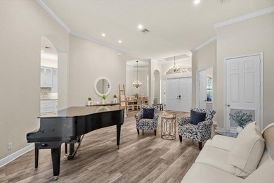 Experience luxury and privacy in this stunning home set on .67 on The Cape Club of Palm City in Florida - for sale on GolfHomes.com, golf home, golf lot