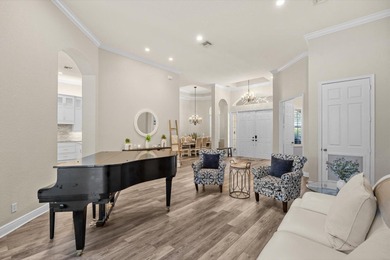 Experience luxury and privacy in this stunning home set on .67 on The Cape Club of Palm City in Florida - for sale on GolfHomes.com, golf home, golf lot