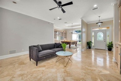 Absolutely Stunning! From the moment you walk in the travertine on Oak Grove Island Golf and Country Club in Georgia - for sale on GolfHomes.com, golf home, golf lot