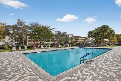 TLC-SALE OF THE CENTURY-POOL IN FRONT OF YOUR BLDG. 1 on Wynmoor Golf Course in Florida - for sale on GolfHomes.com, golf home, golf lot