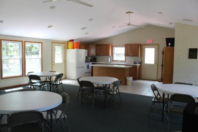 Relax & enjoy yourself. This charming 2004 cottage comes with on Marquette Trails Country Club in Michigan - for sale on GolfHomes.com, golf home, golf lot