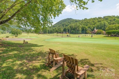 Loaded with rustic charm, this mountain retreat is one of the on Rumbling Bald Resort on Lake Lure in North Carolina - for sale on GolfHomes.com, golf home, golf lot
