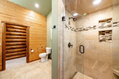 Welcome to 6 Donegal Drive -- a stunning custom log home tucked on The Powder Horn Golf Club - Mountain in Wyoming - for sale on GolfHomes.com, golf home, golf lot