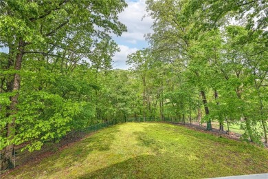 Discover a blend of nature and comfort in this 2 level home on Bella Vista Country Club - Berksdale in Arkansas - for sale on GolfHomes.com, golf home, golf lot