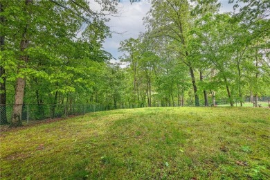 Discover a blend of nature and comfort in this 2 level home on Bella Vista Country Club - Berksdale in Arkansas - for sale on GolfHomes.com, golf home, golf lot