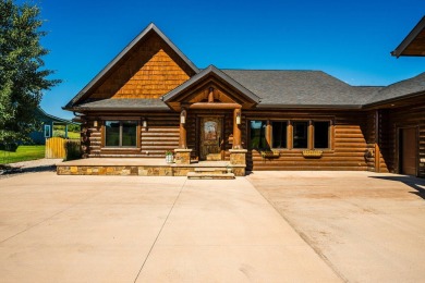 Welcome to 6 Donegal Drive -- a stunning custom log home tucked on The Powder Horn Golf Club - Mountain in Wyoming - for sale on GolfHomes.com, golf home, golf lot