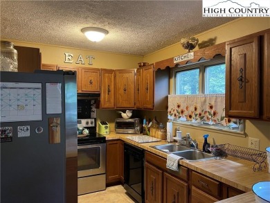 Located in the highly sought-after Linville Land Harbor, this on Land Harbor Golf Course in North Carolina - for sale on GolfHomes.com, golf home, golf lot