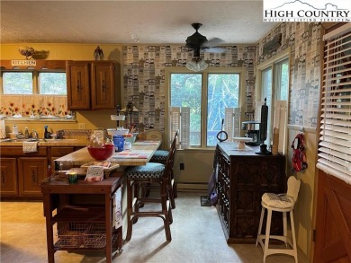 Located in the highly sought-after Linville Land Harbor, this on Land Harbor Golf Course in North Carolina - for sale on GolfHomes.com, golf home, golf lot