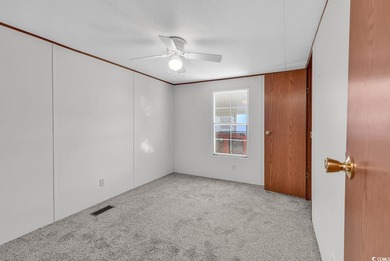 In this well-manicured and gated community of The Parks at Long on Long Bay Club in South Carolina - for sale on GolfHomes.com, golf home, golf lot