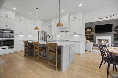 Welcome to a home that truly raises the bar in Traditions of on Traditions of Braselton Golf Club in Georgia - for sale on GolfHomes.com, golf home, golf lot