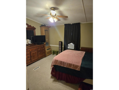Located on a spacious corner lot, this home features a fenced on Prestwick Country Club in South Carolina - for sale on GolfHomes.com, golf home, golf lot