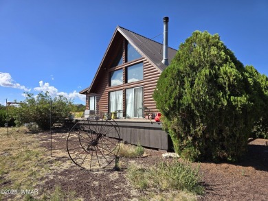 This beautiful Mountain Cabin in White Mountain Lakes has much on Silver Creek Golf Club in Arizona - for sale on GolfHomes.com, golf home, golf lot
