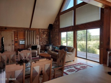 This beautiful Mountain Cabin in White Mountain Lakes has much on Silver Creek Golf Club in Arizona - for sale on GolfHomes.com, golf home, golf lot