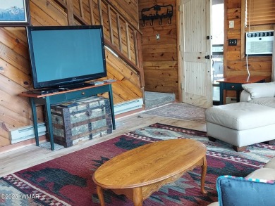 This beautiful Mountain Cabin in White Mountain Lakes has much on Silver Creek Golf Club in Arizona - for sale on GolfHomes.com, golf home, golf lot