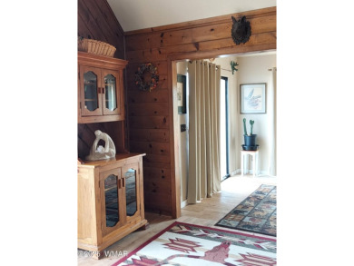 This beautiful Mountain Cabin in White Mountain Lakes has much on Silver Creek Golf Club in Arizona - for sale on GolfHomes.com, golf home, golf lot