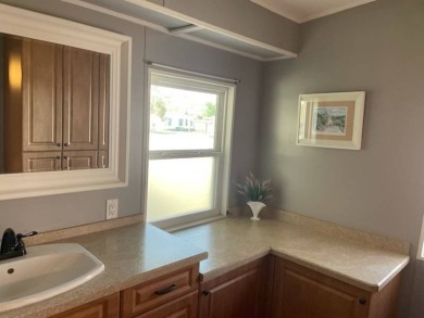 TIRED OF SNOW,ICE AND COLD, TRADE IT IN FOR SUN,WARM AND WHITE on Del Tura Golf and Country Club in Florida - for sale on GolfHomes.com, golf home, golf lot