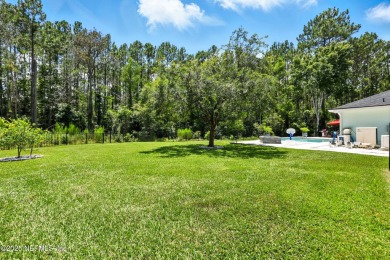 Completely Remodeled Pool Home located on a spacious .51 acre on Cimarrone Golf and Country Club in Florida - for sale on GolfHomes.com, golf home, golf lot