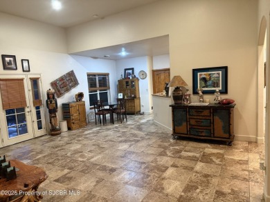 Quality home on the 11th fairway featuring 12 foot ceilings, gas on San Juan Country Club in New Mexico - for sale on GolfHomes.com, golf home, golf lot