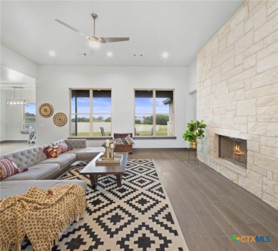 Experience refined living in this beautifully built 2022 home on Apple Rock Golf Course - Horseshoe Bay in Texas - for sale on GolfHomes.com, golf home, golf lot