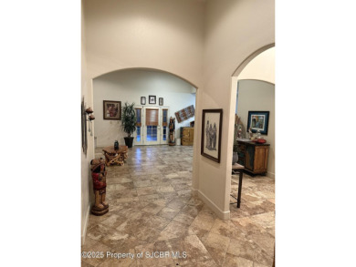 Quality home on the 11th fairway featuring 12 foot ceilings, gas on San Juan Country Club in New Mexico - for sale on GolfHomes.com, golf home, golf lot