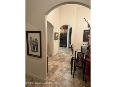 Quality home on the 11th fairway featuring 12 foot ceilings, gas on San Juan Country Club in New Mexico - for sale on GolfHomes.com, golf home, golf lot