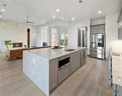 Experience refined living in this beautifully built 2022 home on Apple Rock Golf Course - Horseshoe Bay in Texas - for sale on GolfHomes.com, golf home, golf lot