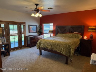 Quality home on the 11th fairway featuring 12 foot ceilings, gas on San Juan Country Club in New Mexico - for sale on GolfHomes.com, golf home, golf lot