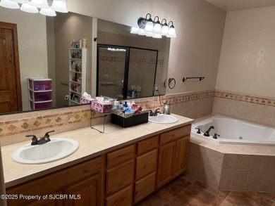 Quality home on the 11th fairway featuring 12 foot ceilings, gas on San Juan Country Club in New Mexico - for sale on GolfHomes.com, golf home, golf lot