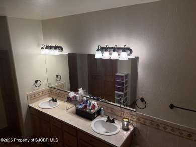 Quality home on the 11th fairway featuring 12 foot ceilings, gas on San Juan Country Club in New Mexico - for sale on GolfHomes.com, golf home, golf lot